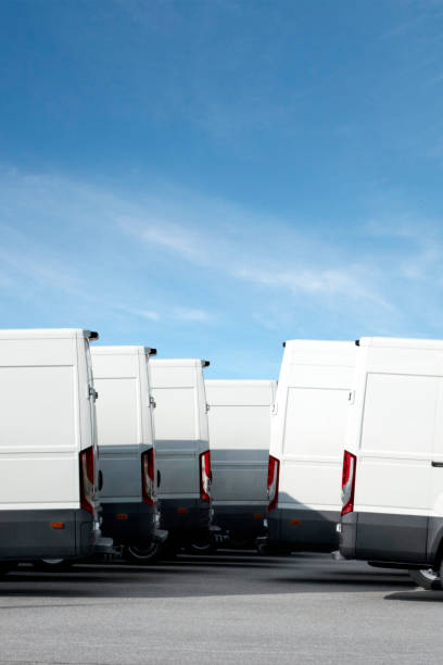 istock Group of white delivery vans 1165465345