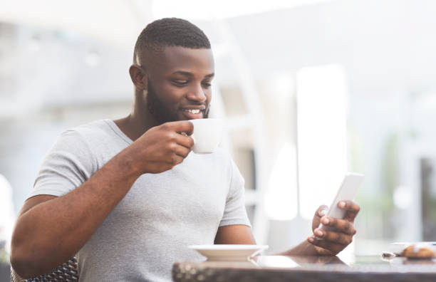 istock African american man having a breakfast in cafe 1165465632