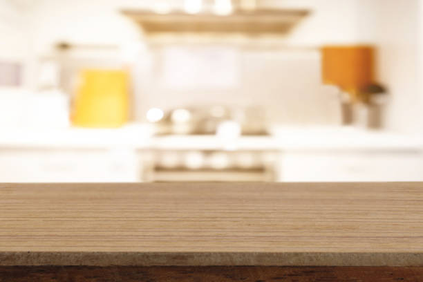 istock Perspective empty wooden table on top over blur background, can be used mock up for montage products display or design layout. 1165465664