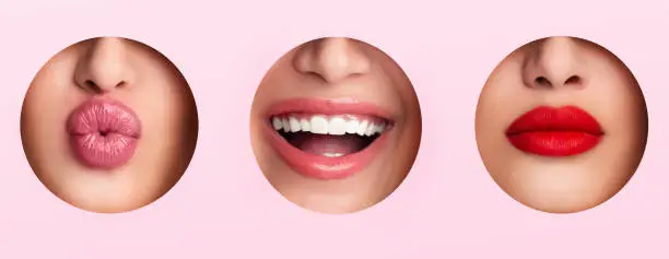 Calm, smiling and kissing Lips with lipstick in three different holes, panorama, pink background