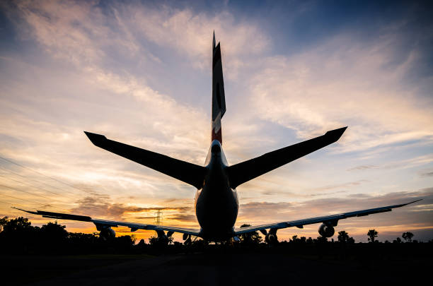 istock The silhouette of airplane stop for support service and transfer passenger 1165467780