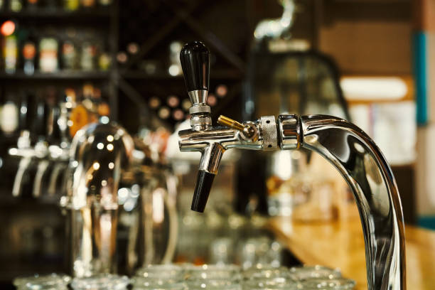 istock Metallic beer tap at bar counter. 1165468162
