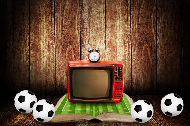 istock Watching football game on vintage television at home 1165472158