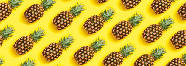istock Pineapple on yellow background. Minimal concept. top view 1165473858