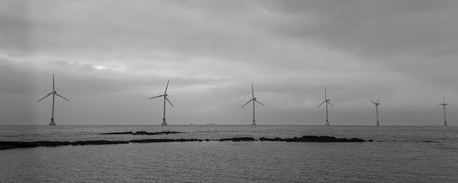 A panoramic view of the coast and wind power generators installed in the sea, Jeju korea
