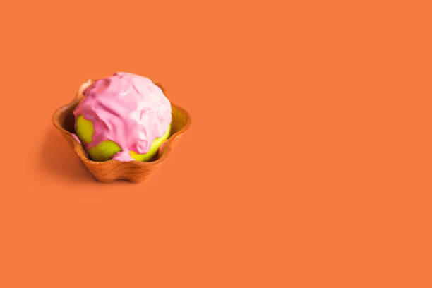 istock Tennis ball with pink paint in waffle cup 1165474175