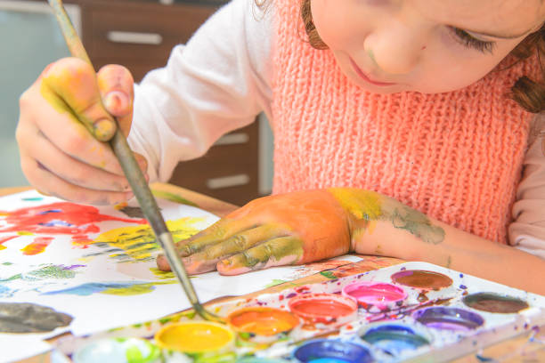 istock The girl draws paints. 1165474946
