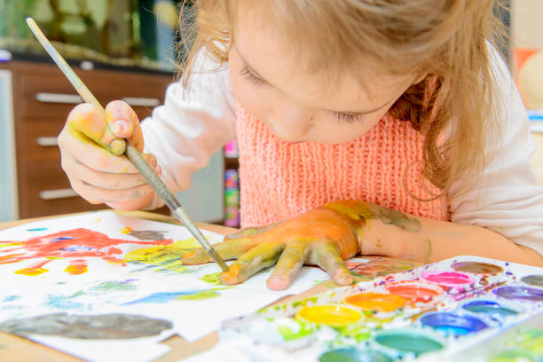 istock The girl draws paints. 1165474947