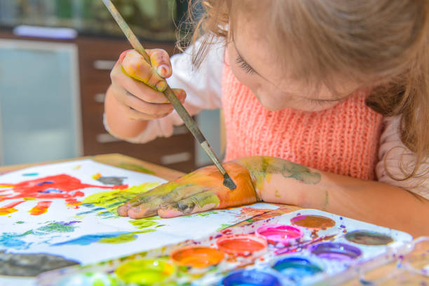 istock The girl draws paints. 1165474991