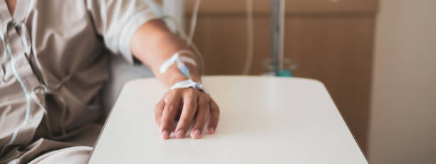 Calm patient and infusion Calm patient got medicine injection on left hand during admission and medical operation in hospital. chemotherapy drug stock pictures, royalty-free photos & images