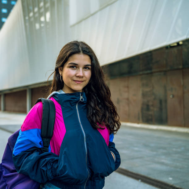 istock Young student walking with her bakcpack in a Barcelona 1165477800