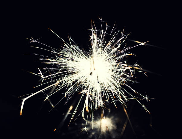 istock christmas sparkler glowing in the dark 1165478962