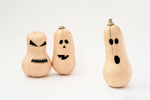 istock Funny scary face Halloween pumpkins on white background. 1165483091