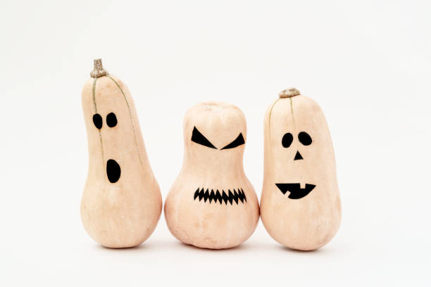istock Funny scary face Halloween pumpkins on white background. 1165483107