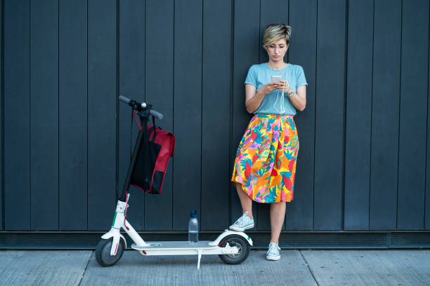 istock Business woman using electric scooter 1165485088