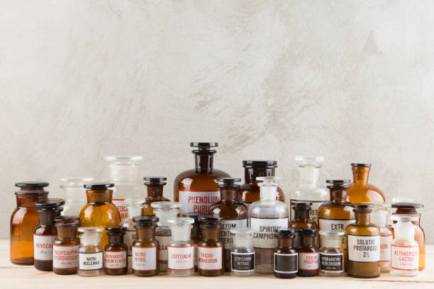 istock Retro pharmacy - vintage pharmacy bottles on wooden board 1165486013