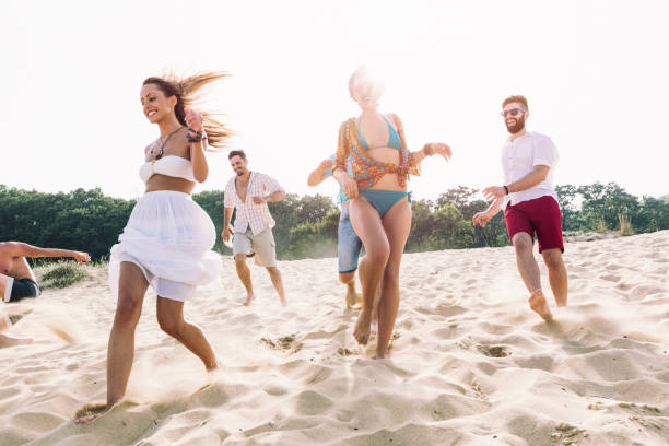 istock Young people having fun on the beach 1165489054