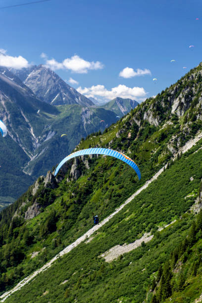 istock Flying on a paraglider. Chamonix France. 1165489253
