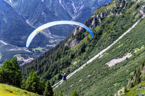 istock Flying on a paraglider. Chamonix France. 1165489257