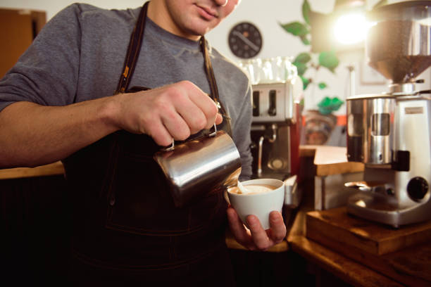 istock Coffee Latte Barista making pattern in a cup of coffee shop. 1165493814