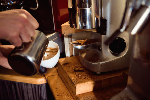 istock Coffee Latte Barista making pattern in a cup of coffee shop. 1165493864