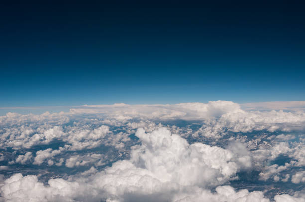 istock Above view from plane on blue sky and clouds 1165494959