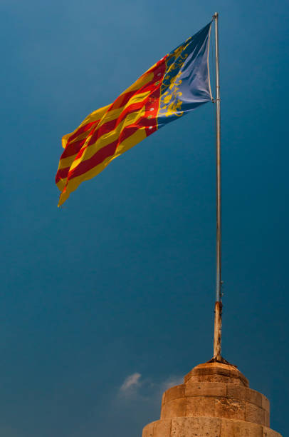istock Flag of Community Valencia blowing on the wind 1165495233