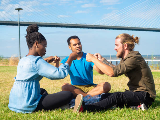 istock Smiling multiethnic friends on picnic 1165495800