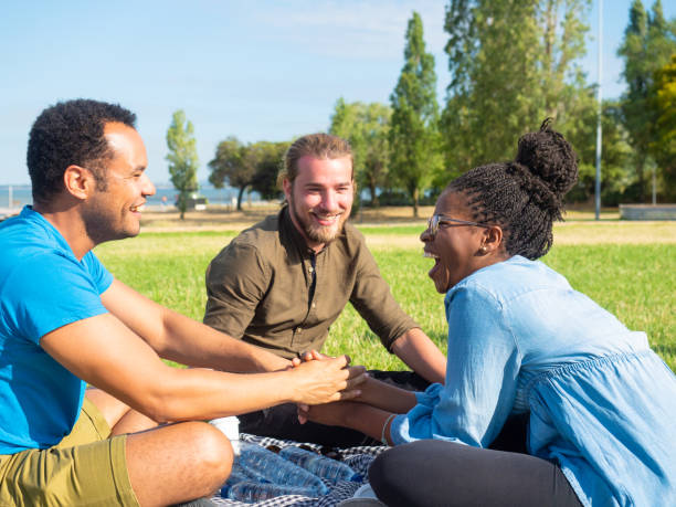 istock Multiethnic friend having fun on picnic 1165496524