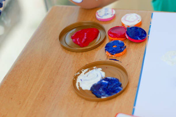 istock Mixed paints and stamps on the table 1165498697