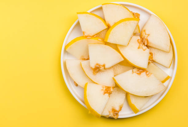istock Sliced Yellow Musk Melon Served on Plate, Pastel Background and Copy Space 1165501324