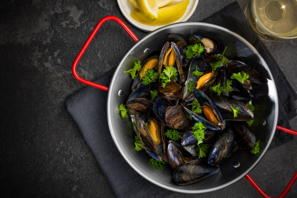 istock Seafood Dish, Mussels with Parsley,Lemon and White Wine, Top View 1165502649