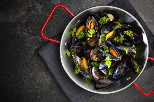 istock Mussels with Fresh Parsley, Seafood Dish, Top View 1165502920