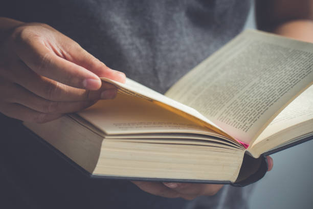 istock Close up hand open the Bible,Sunday readings, Bible 1165502984