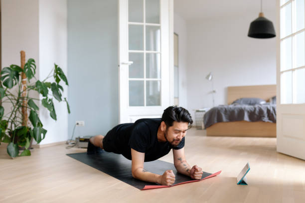 istock Asian man holding hard plank position 1165505210