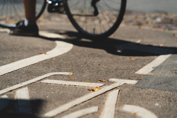 istock Bike path with stencil on asphalt 1165505465