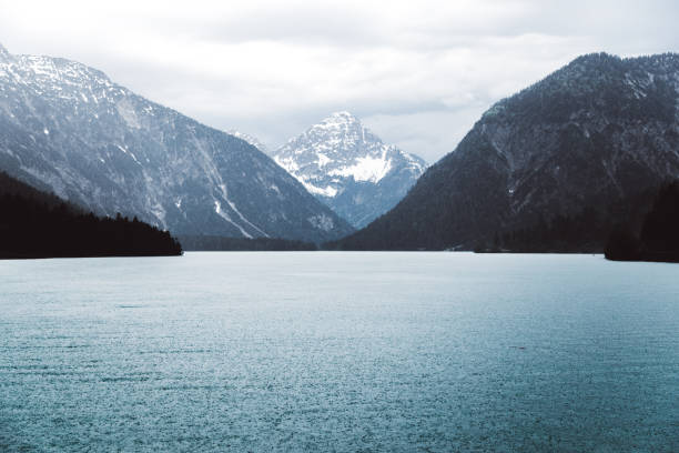 istock Beautiful mountain lake Plansee in Austrian Alps during the rain 1165506408