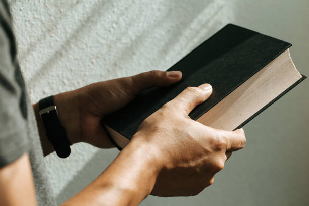 istock Man holding a bible in his hands.believe concept 1165510661