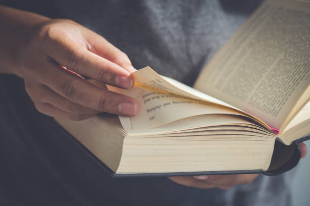 istock Close up hand open the Bible,Sunday readings, Bible 1165510819