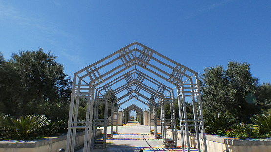 A metal arch entryway for Ta Qali National Park, a public garden in Malta