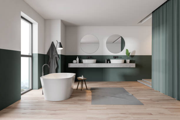 istock Green and white bathroom, tub and sink 1165513972