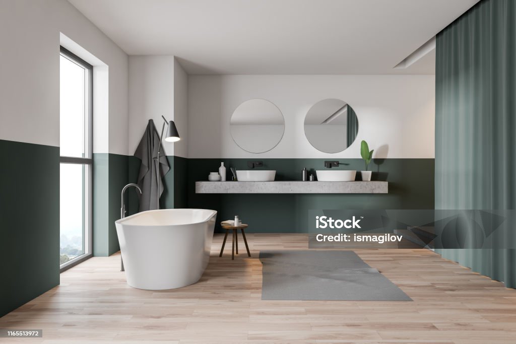 Green and white bathroom, tub and sink Interior of stylish bathroom with green and white walls, wooden floor, white bathtub, double sink and curtains. 3d rendering Domestic Bathroom Stock Photo