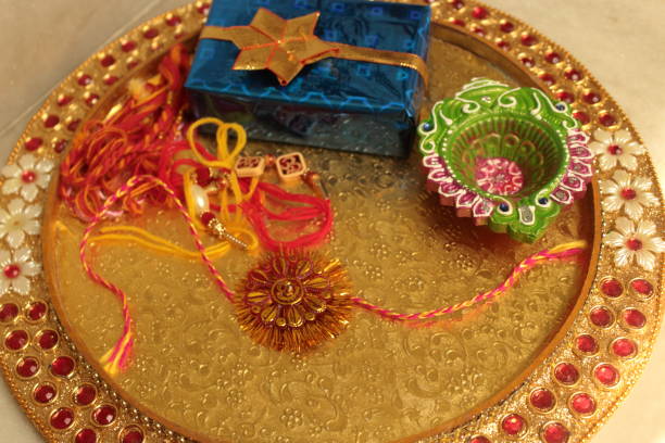 Indian festival: Rakshabandhan or rakhi festival Rakhi with gift, diya mirror work thali decoration stock pictures, royalty-free photos & images