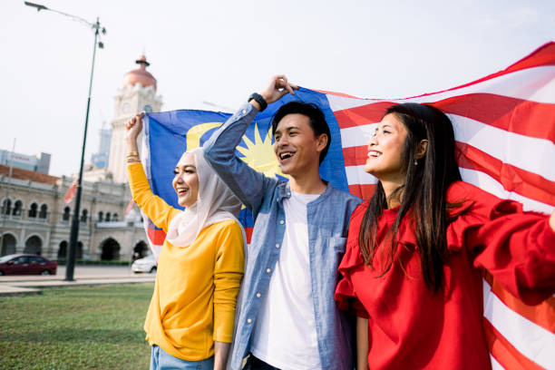 istock Young Adult Celebrating Malaysia Independence Day 1165515548