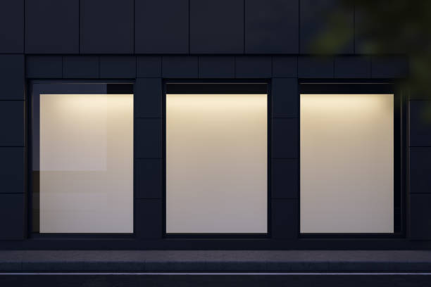 istock Three mock up posters in shop window at night 1165515764