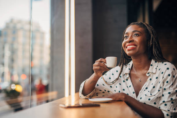 istock Woman drinking coffee in cafe 1165516581