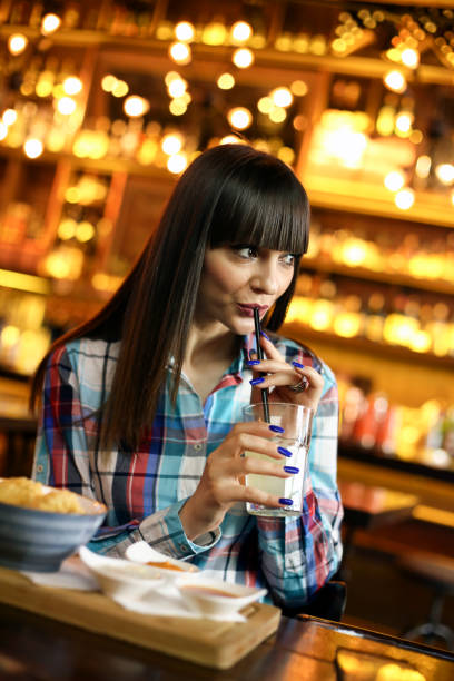 istock Young woman in a restaurant 1165516628