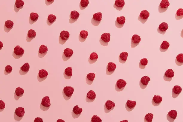 Raspberry, pink background, flat lay, directly above