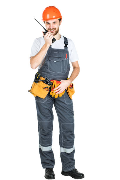 istock The builder talks, swears on thewalkie-talkie. isolated on white background 1165518057