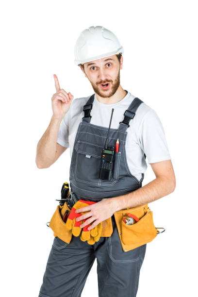 istock A builder or an employee in a protective helmet reflected on the background of the white wall 1165518200